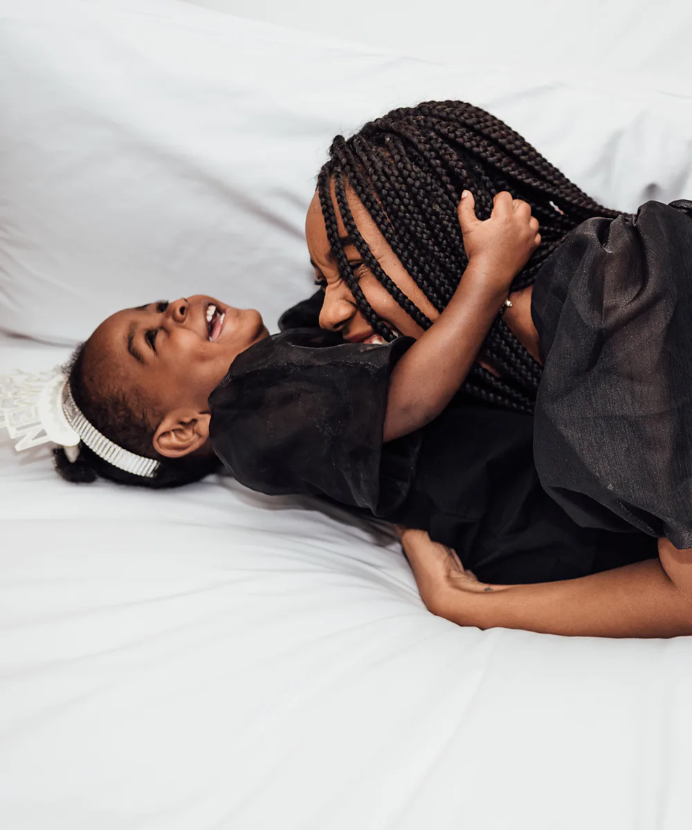 Black mother and daughter sharing a laugh