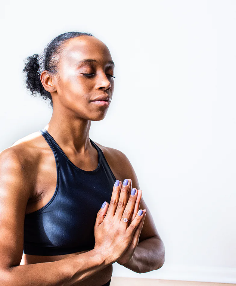 Black young woman meditating